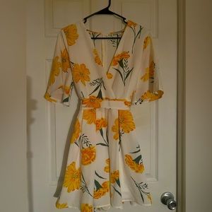 White romper with yellow flowers